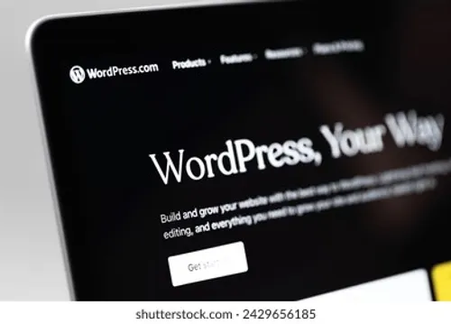 A WordPress.com dashboard on a laptop screen, shot close and at an angle
